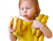 girl with bananaisolated on white