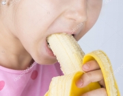 Child eating banana