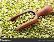 Dried green peas with wooden scoop