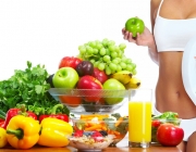 Young healthy woman with fruits.