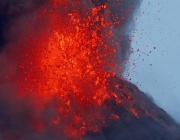 Mayon volcano spews molten lava during its sporadic eruption early Thursday, Jan. 25, 2018 as seen from a village in Legazpi city, Albay province, around 340 kilometers (200 miles) southeast of Manila, Philippines. The Philippine Institute of Volcanology and Seismology said the volcano that's been erupting for almost two weeks still appears to be swelling with magma under the surface. More than 74,000 people are staying in dozens of emergency shelters as Mount Mayon continues to belch lava, ash and superheated gas and rocks. (AP Photo/Bullit Marquez) Philippines Volcano