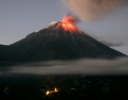 TOPSHOTS
Picture taken on August 31, 2014 from Banos, Ecuador, of the Tungurahua volcano spewing smoke and flames. AFP PHOTO/API/CARLOS CAMPANA